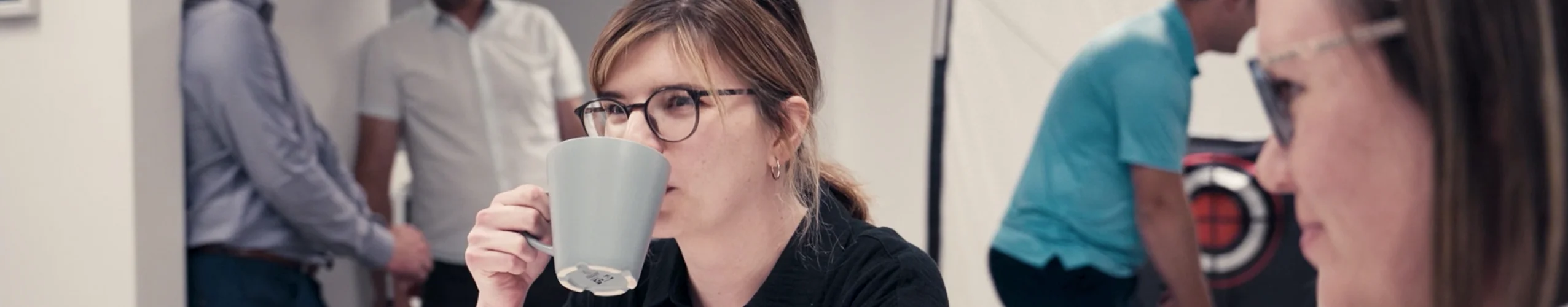 Office worker drinking coffee